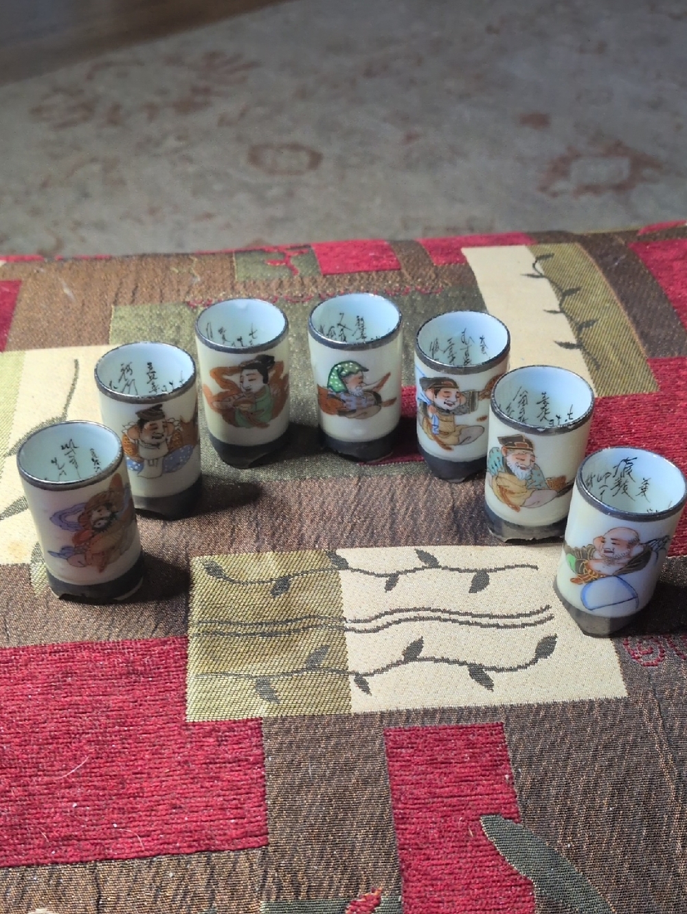 7 Vintage Hand-Painted Porcelain Shot Glass Set - White with Multicolor Figures